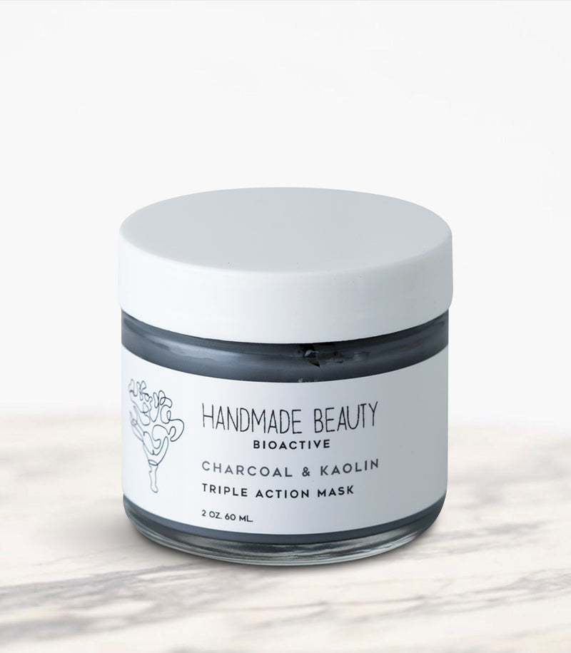 Charcoal & Kaolin Triple Action Mask 2 oz (60 ML) - Handmade Beauty Face   Charcoal &amp; Kaolin Triple Action Mask detoxifying rose-scented mask with 3 earth clays KEY BENEFITS Eliminates oils &amp; dirt while visibly reducing pores Gently cleanses stressed, polluted skin Leaves face feeling refreshed &amp; radiant Charcoal Masks are one of the hottest trends in the beauty industry right now. Our powerful combination of charcoal and three triple-action clays will leave your customers with smooth, natural